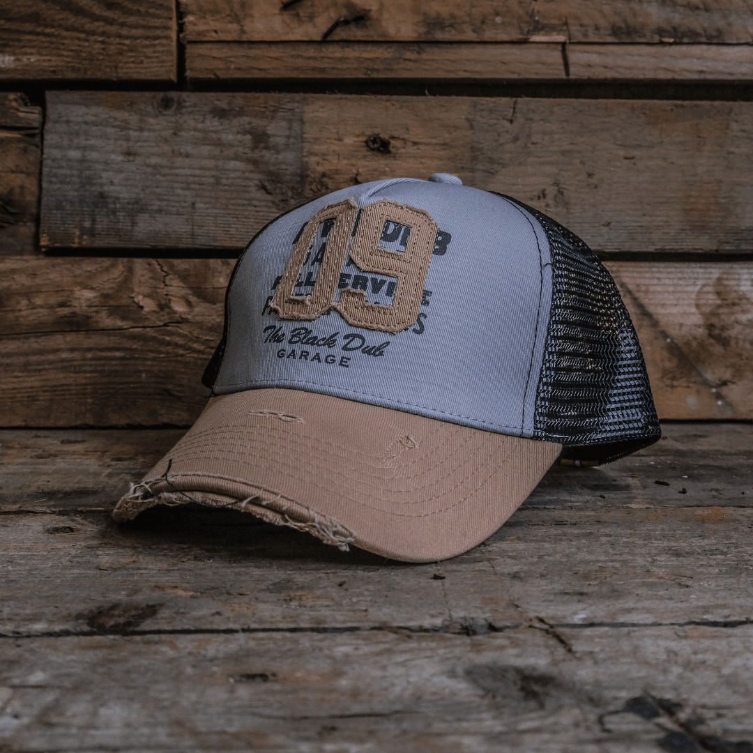 Uggly and Co Stone Parts & Spares '09' trucker hat featuring a classic design with mesh back and adjustable strap.