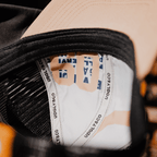 Stone Parts & Spares '09' trucker hat by Uggly and Co, featuring adjustable mesh back and branded front panel.