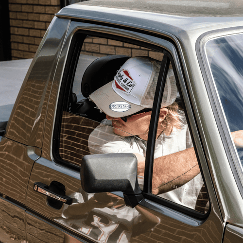 Uggly and Co 'Original' Diamond Trucker Cap showing a classic trucker hat with diamond logo embroidery on the front panel.