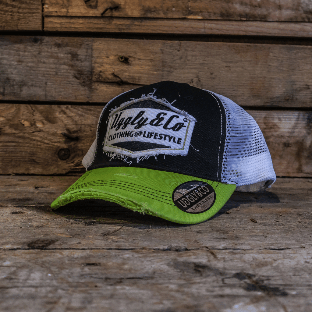 Yellow and white diamond-patterned trucker cap by Uggly and Co featuring a classic mesh back and curved brim.