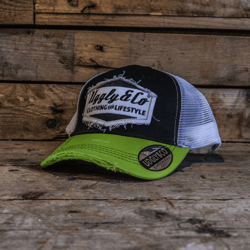 Yellow and white diamond-patterned Uggly and Co trucker cap with mesh back and curved brim.
