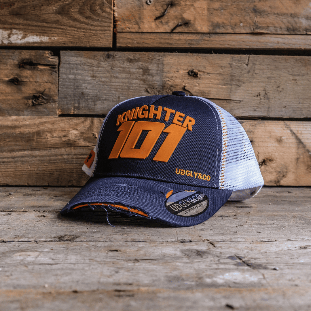 Uggly and Co David Knight 101 Trucker Hat featuring a mesh back and embroidered front logo on a casual trucker cap