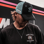 Black and blue Uggly and Co trucker cap featuring official Davey Todd merchandise, with mesh back and curved brim.
