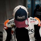 Uggly and Co diamond trucker cap featuring Jeremy McWilliams #99 embroidered logo on structured mesh and curved brim.