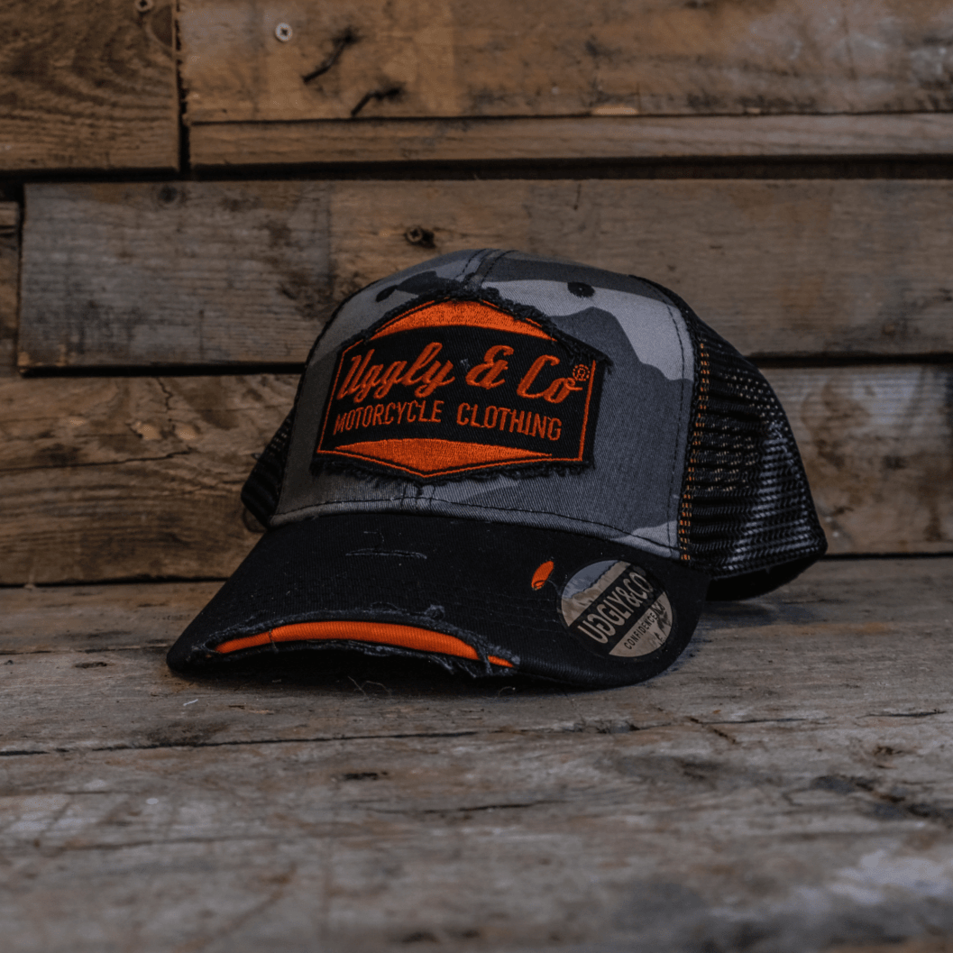 Grey camo diamond trucker hat by Uggly and Co featuring a classic mesh back and structured front with diamond pattern design.