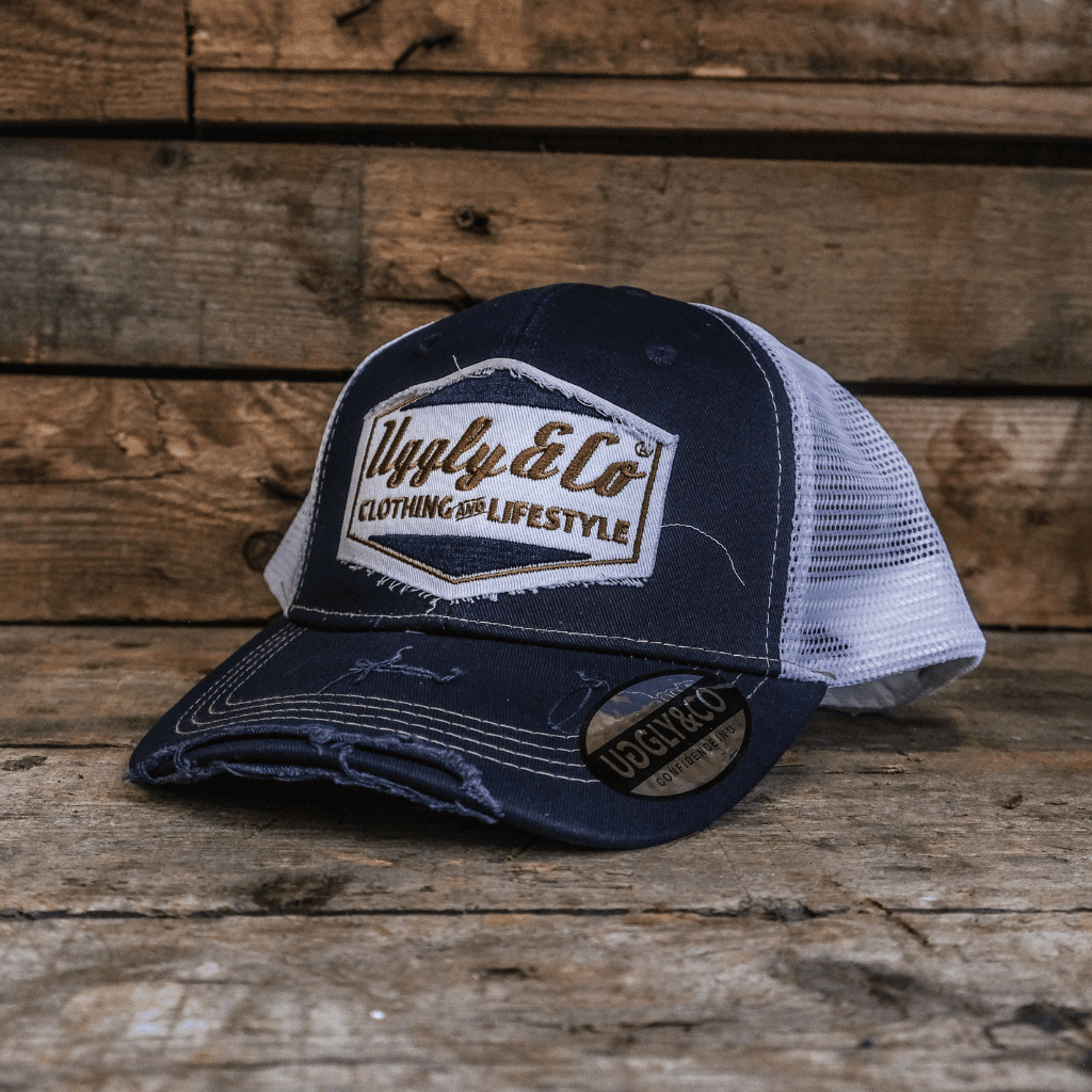 Night blue and gold diamond trucker cap by Uggly and Co with mesh back and curved brim, styled for casual wear.