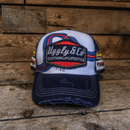 Uggly and Co retro blue and red diamond trucker cap, adjustable mesh trucker hat with bold geometric pattern and curved brim.