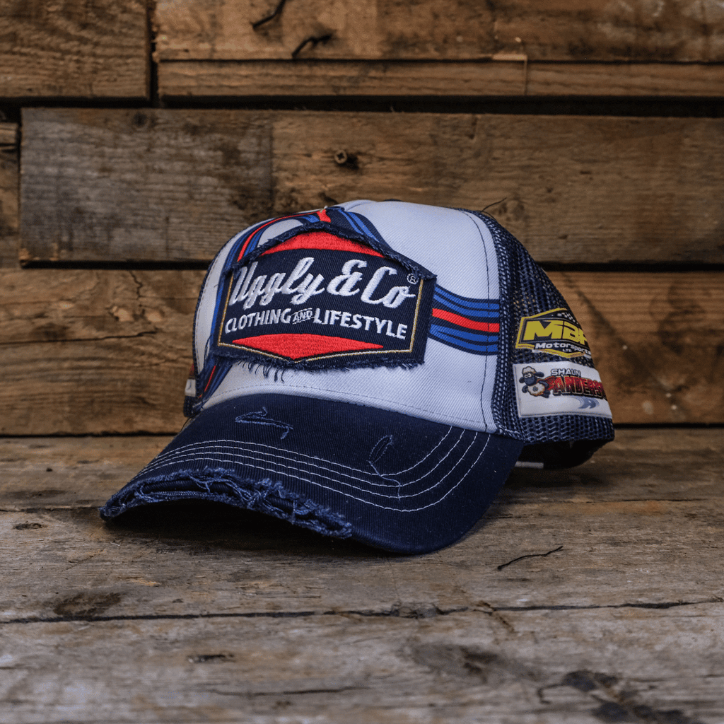 Uggly and Co retro blue and red diamond pattern trucker cap with mesh back and curved brim.