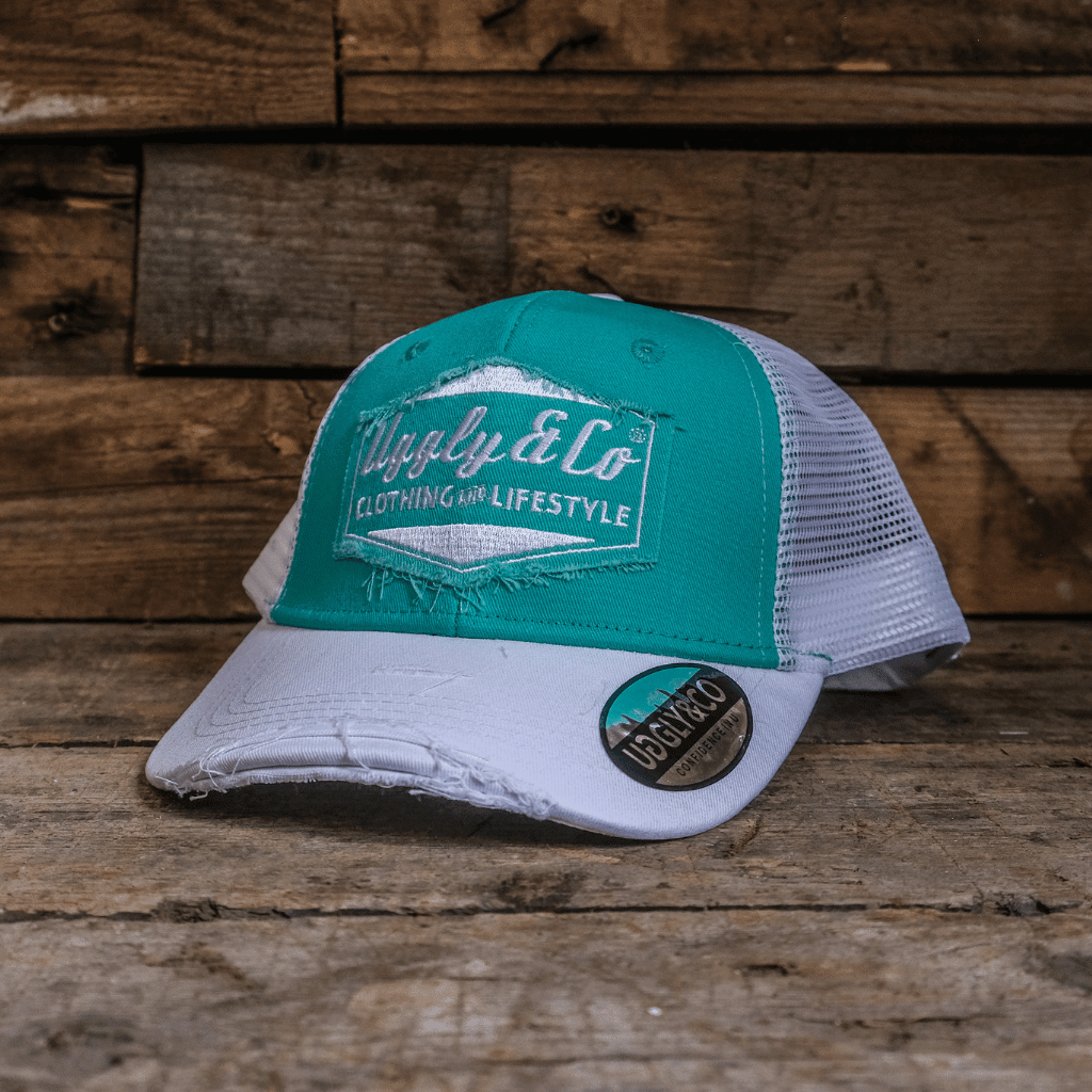 Turquoise and white diamond-patterned trucker cap by Uggly and Co featuring a classic retro style for men