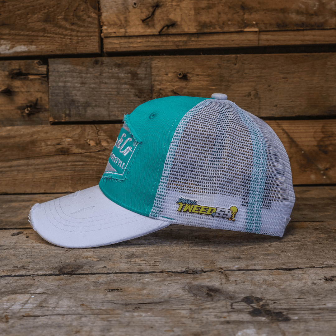 Turquoise and white diamond trucker cap by Uggly and Co with mesh back and curved brim, stylish biker headwear.