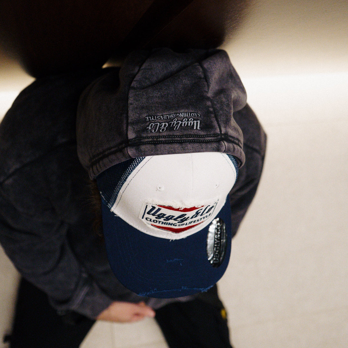 Top view of Uggly and Co Navy Blue and White Diamond Trucker Cap showing mesh back and structured front with diamond pattern.