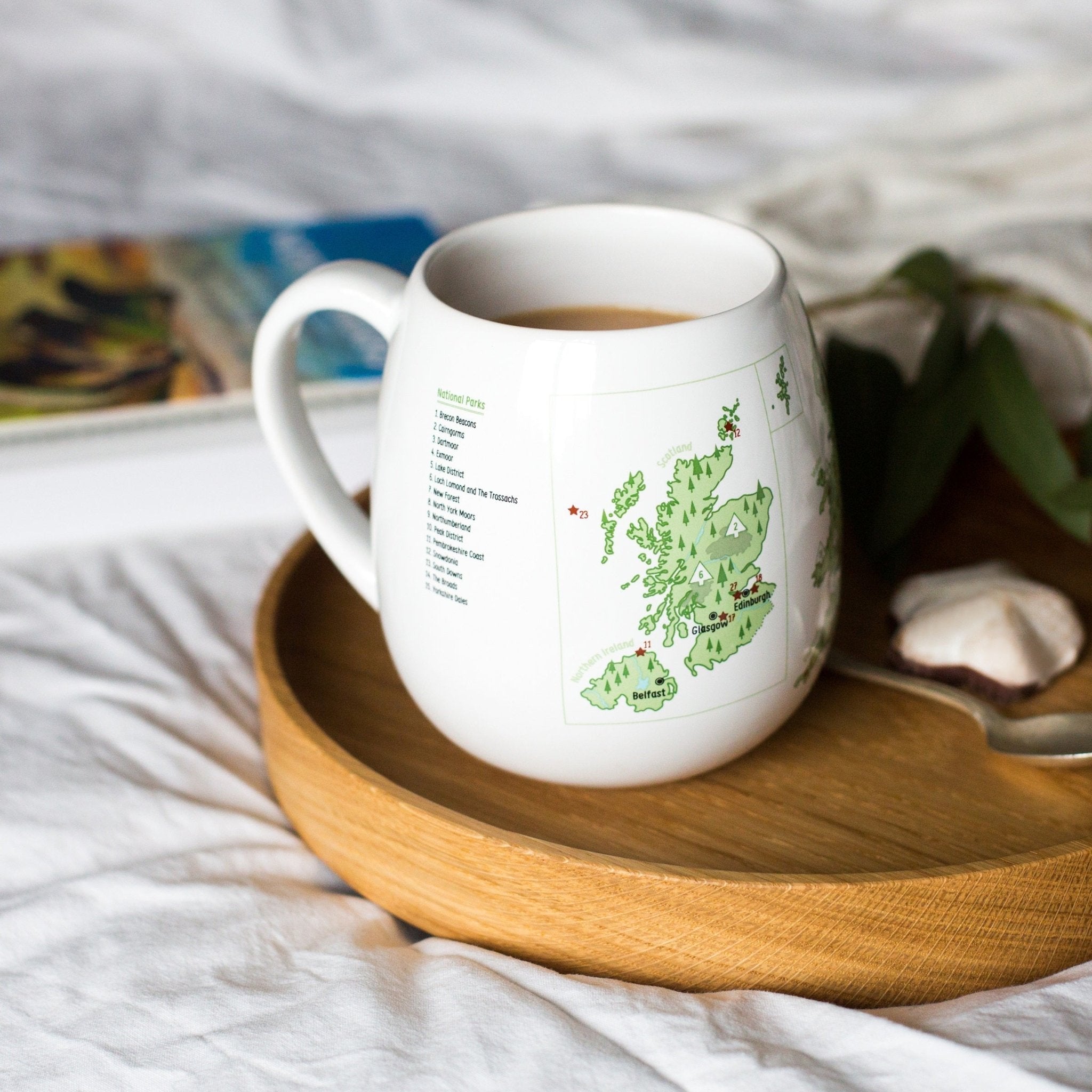 Trouvaille UK Explorer Colour-In Mug featuring a map of UK travel destinations on a white ceramic mug.