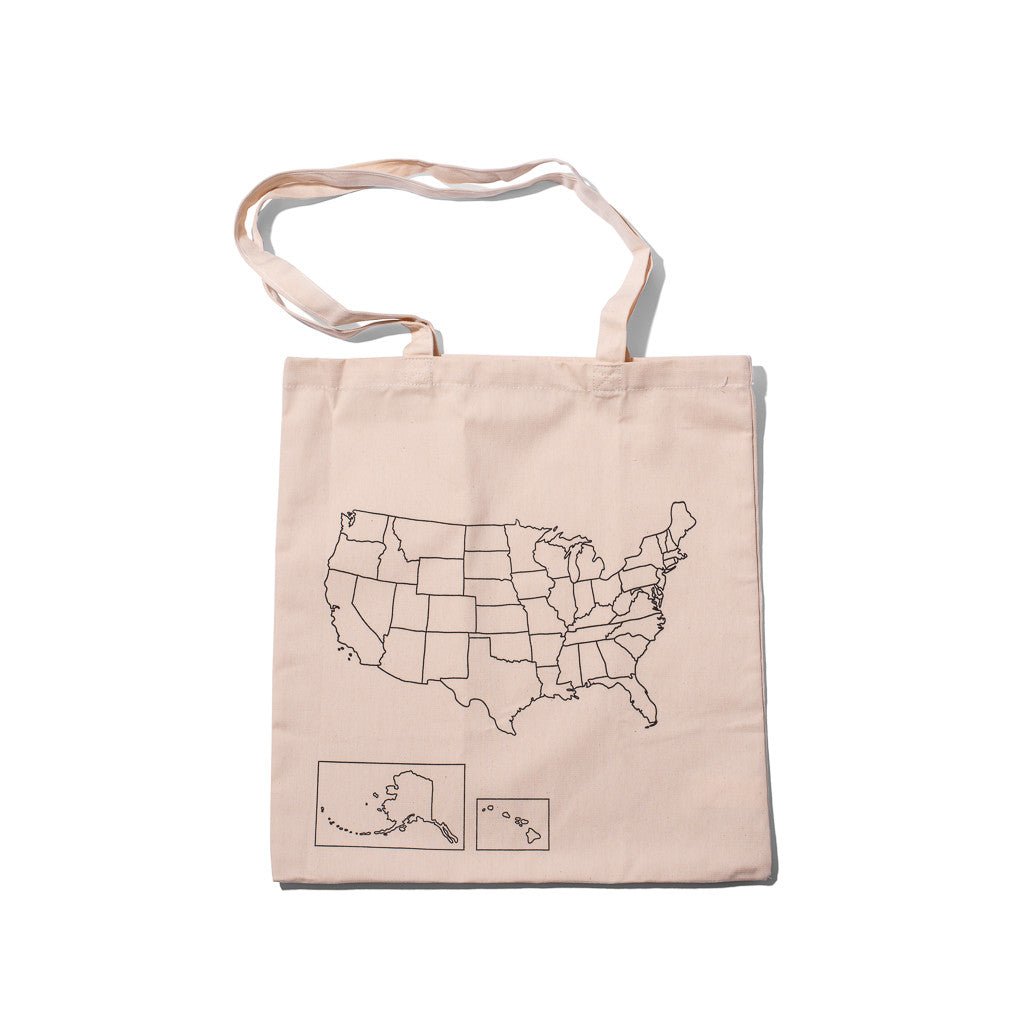 Colorful USA map design on Trouvaille travel tote bag, showing detailed map artwork on durable fabric tote for travel and everyday use.
