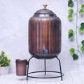 Pure copper water dispenser with glass and stand, antique rope design, 5L or 8L capacity, handcrafted Ayurvedic copper water jar.
