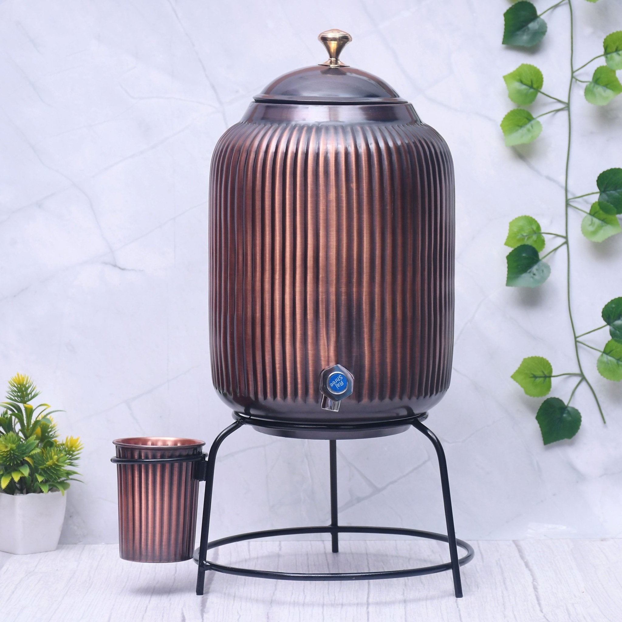 Pure copper water dispenser with glass and stand, antique rope design, 5L or 8L capacity, handcrafted Ayurvedic copper water jar.