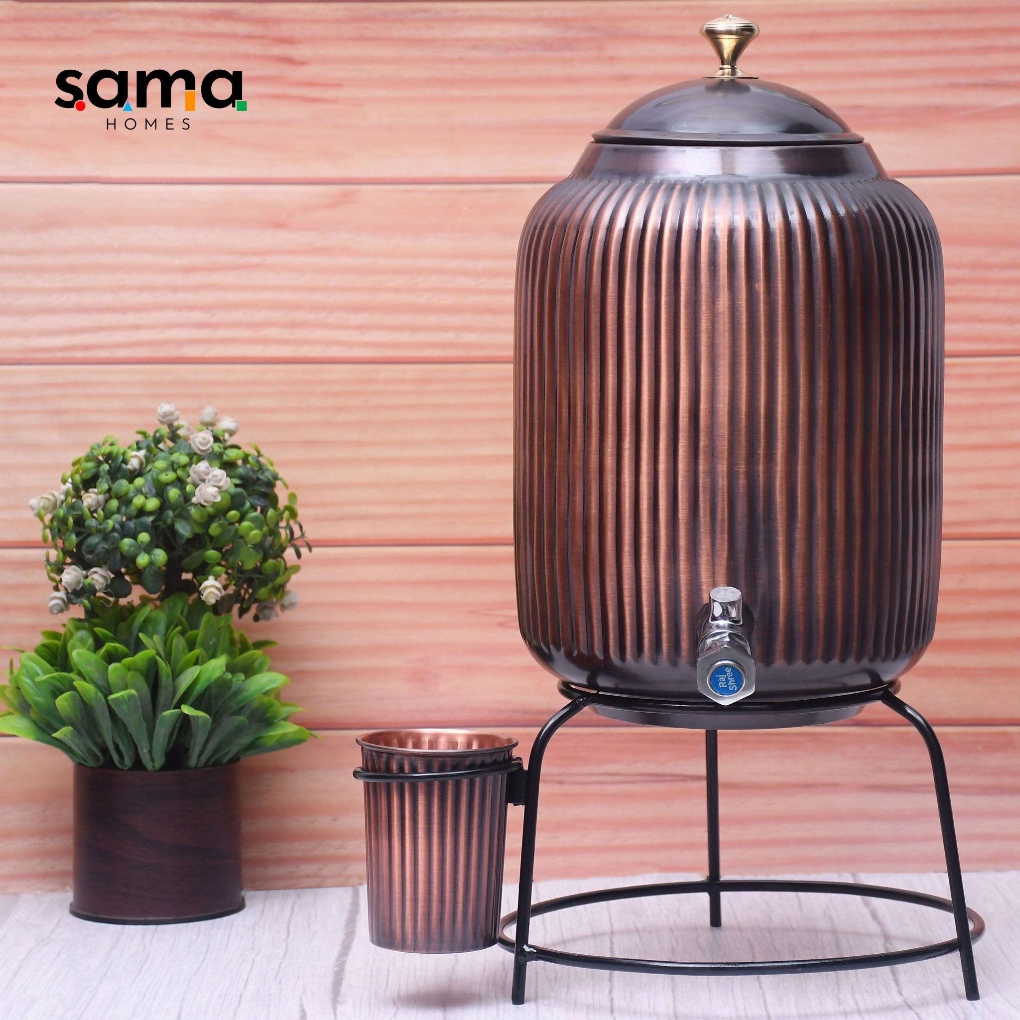 Handcrafted pure copper water dispenser with antique rope design, glass container, and stand, available in 5L and 8L sizes.