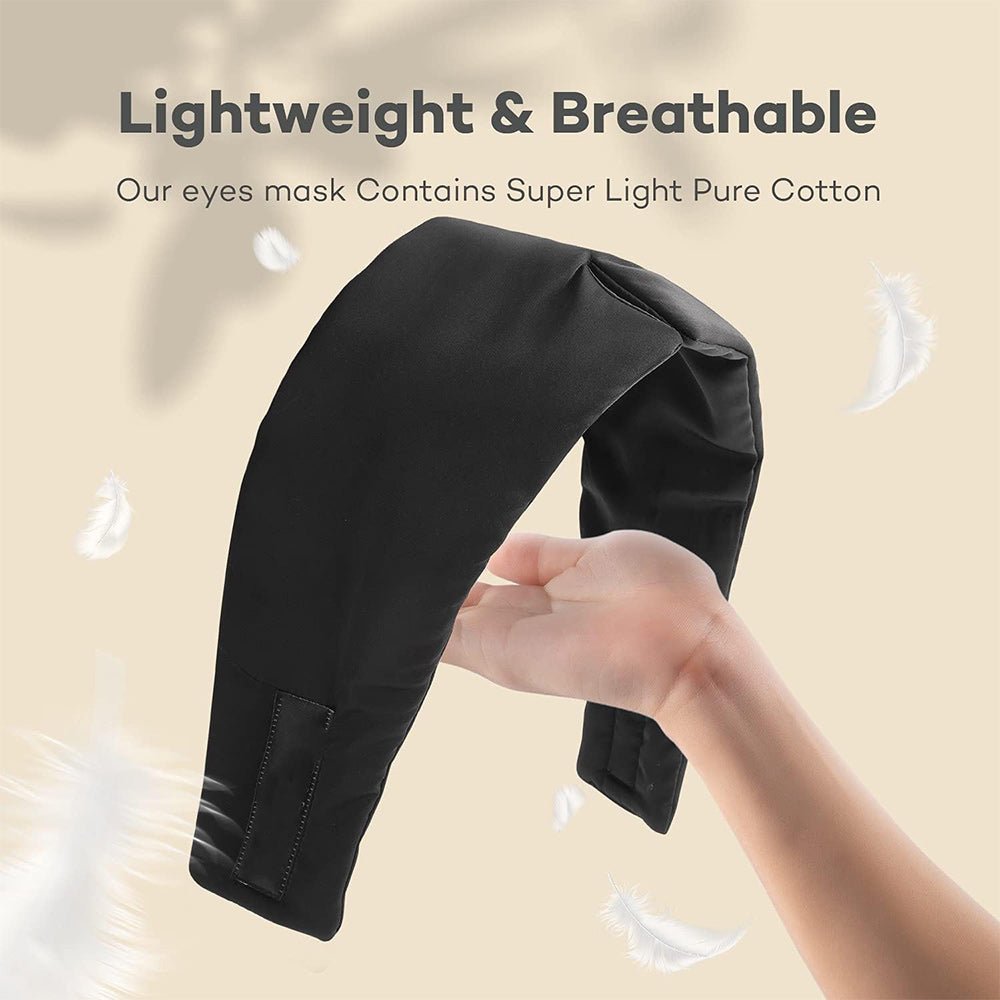 Black silk sleep mask from DREAMSILK, designed to block out light for restful sleep, with smooth, luxurious fabric.