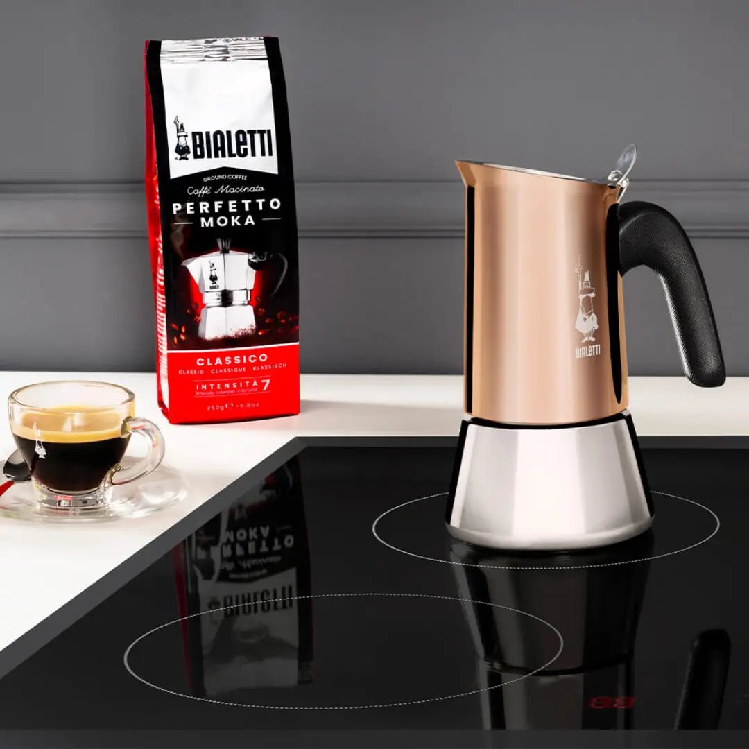 Bialetti Venus copper stovetop coffee maker by Brew Italia, induction-compatible, with a sleek, polished finish and ergonomic handle.