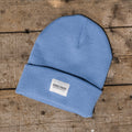 Blue Uggly and Co beanie hat with a cozy knit texture, perfect for casual winter wear.