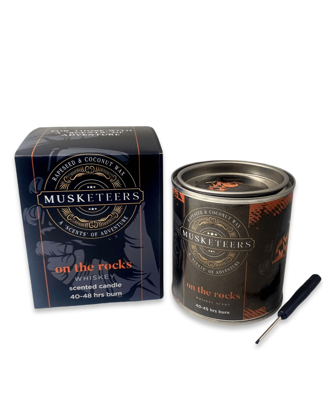 Whisky-scented Musketeers luxury candle with masculine design, featuring warm amber tones and a flickering flame.
