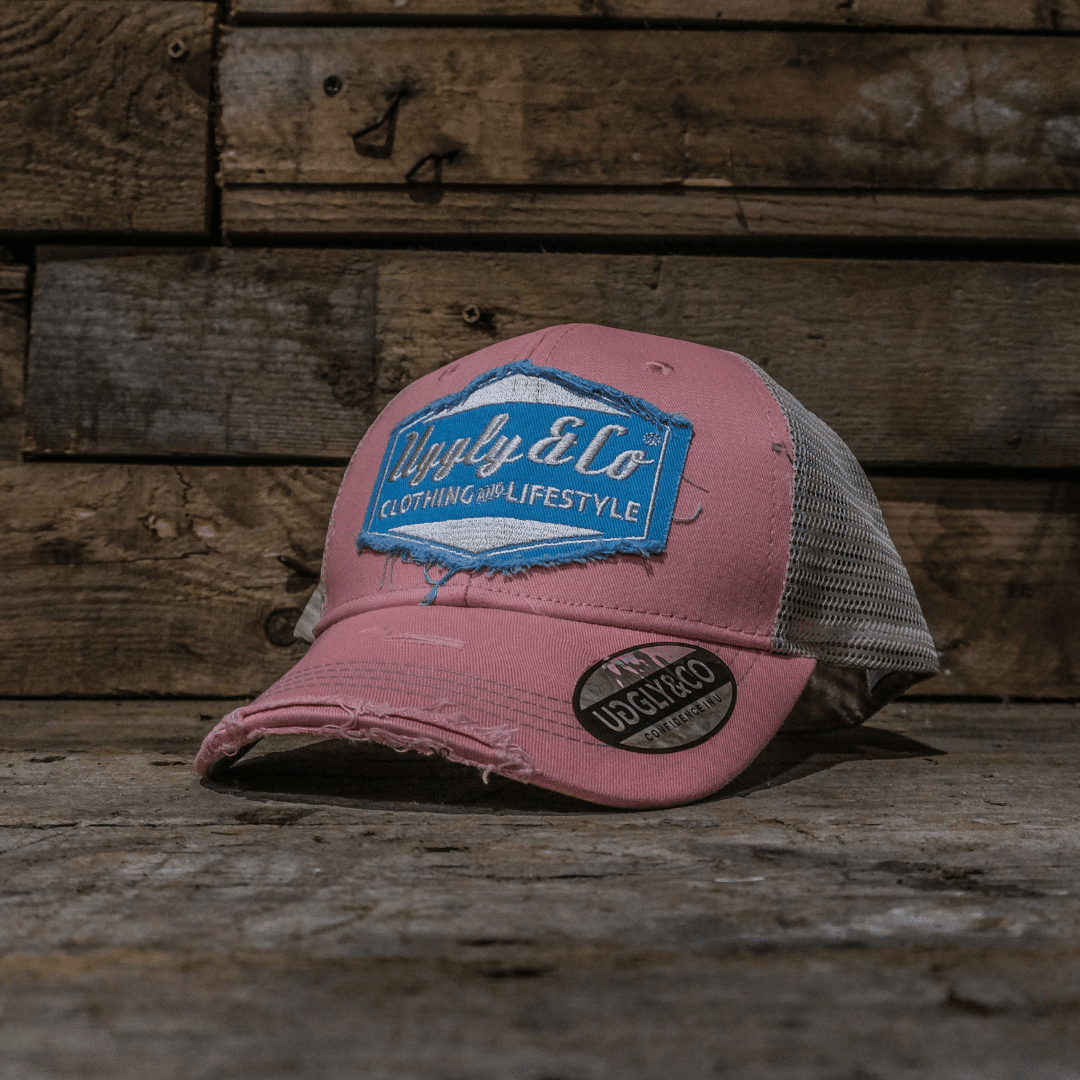 Pastel pink and blue diamond trucker cap for women by Uggly and Co, featuring adjustable mesh back and stylish design.